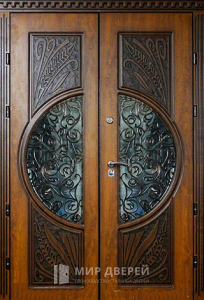 Парадная дверь с коваными элементами №101 - фото №1