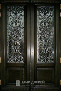Кованая дверь со стеклом в дом №12 - фото вид снаружи